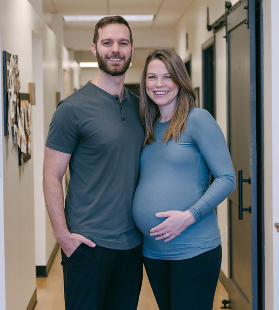 Dr. Andrew Oestreich with his wife in the Landmark Chiropractic office, Waco, TX